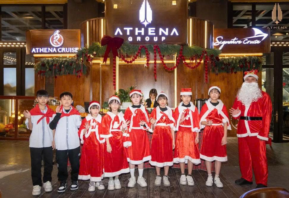 Children enjoying photo moments with Athena Santa Claus.